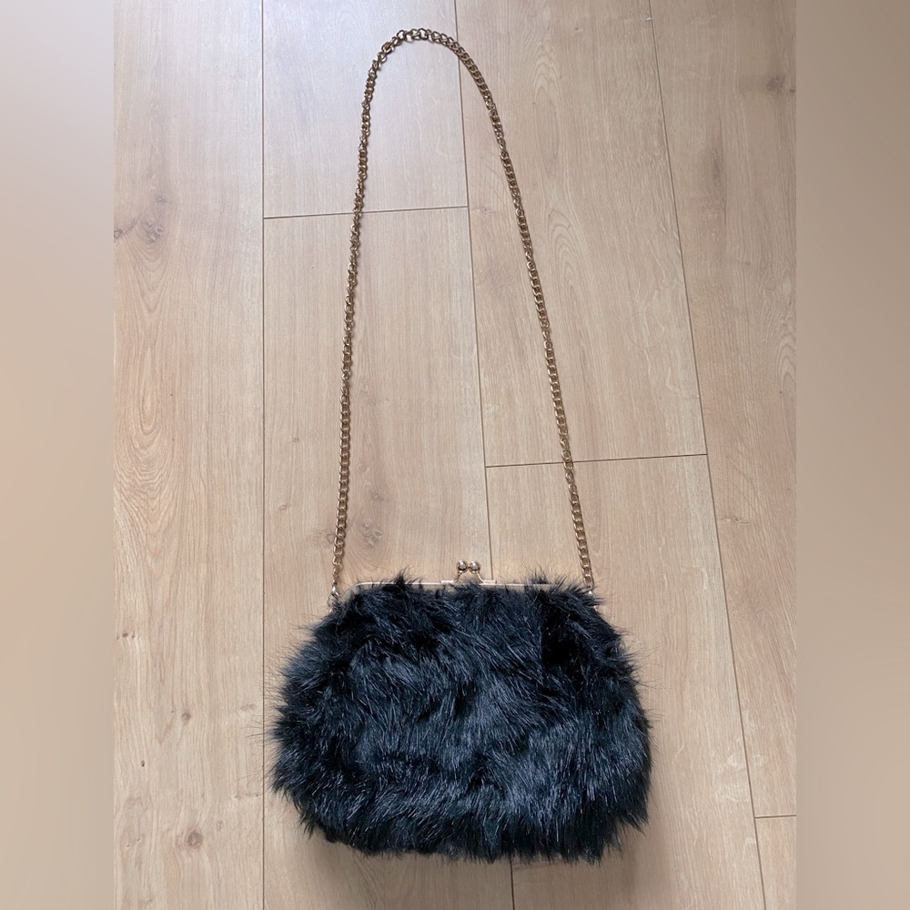 Black Fur Purse with a Clasp and Gold Chains